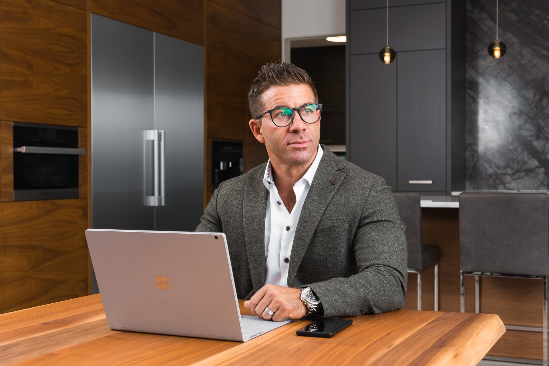 AJ Hazzi, founder of the Vantage Group of Companies, at his laptop
